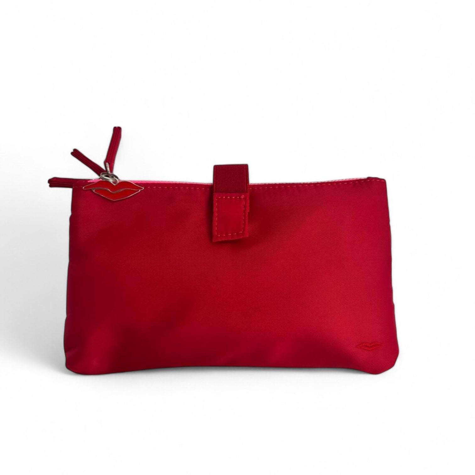 Folded red beauty organiser with elastic closure and clear compartments