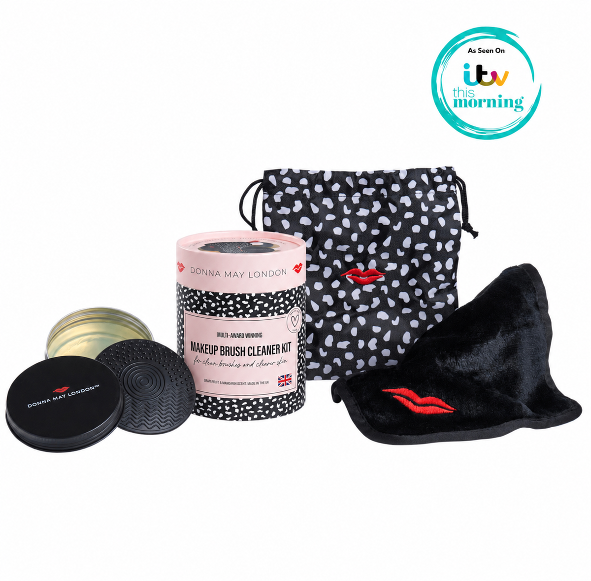 Makeup brush cleaner kit with a polka dot pouch and black hat on a white background.