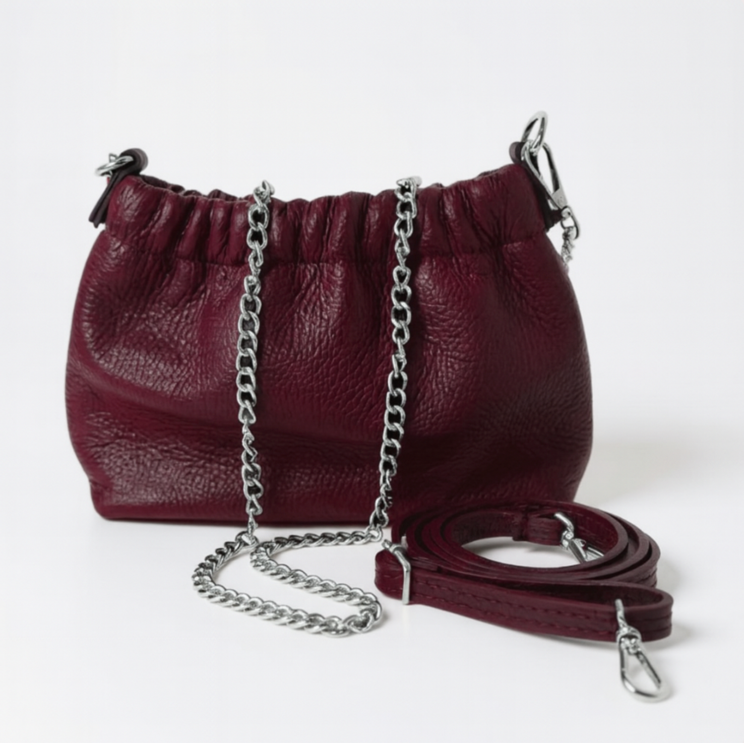 maroon coloured cross body bag