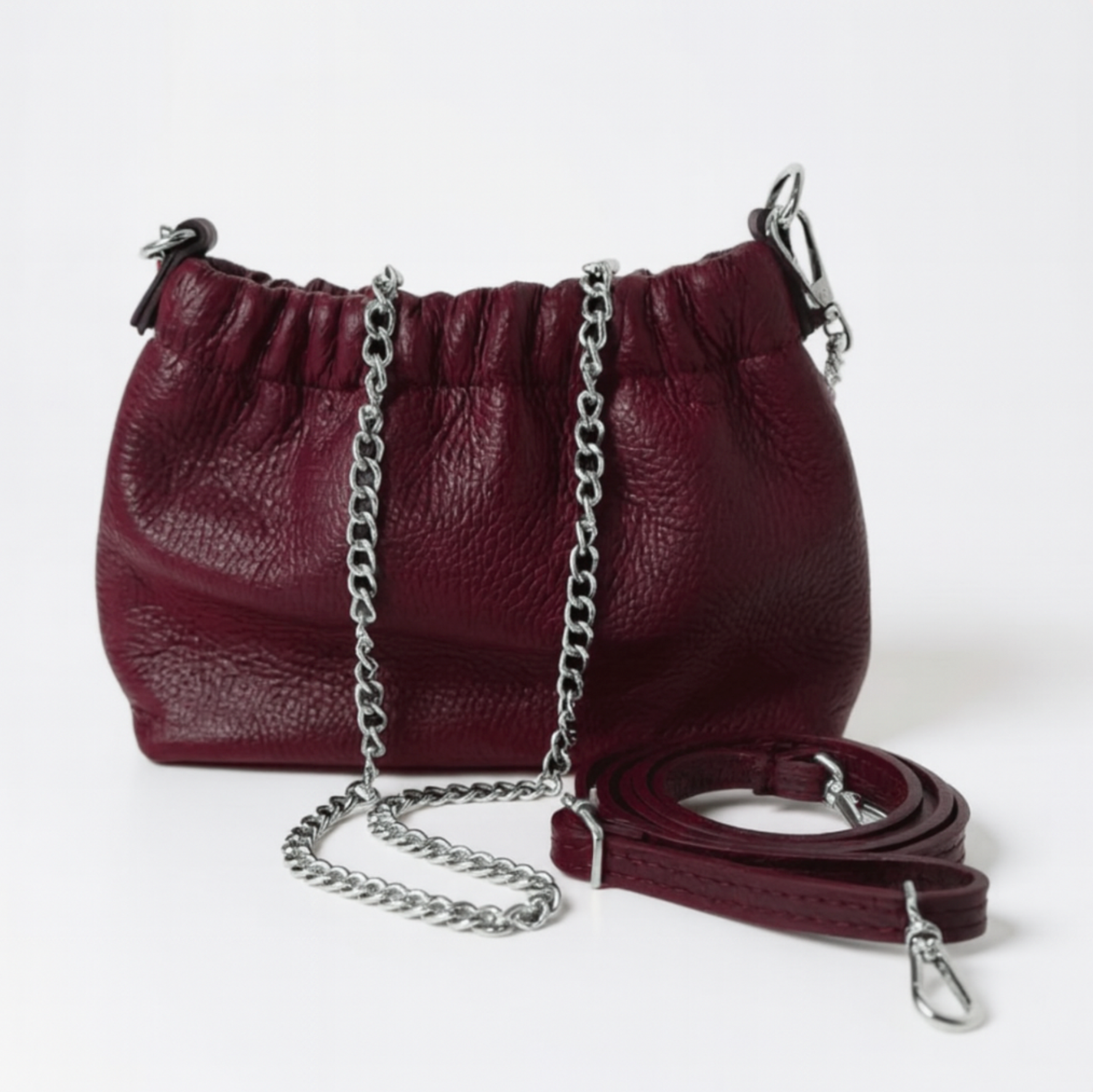 maroon coloured cross body bag