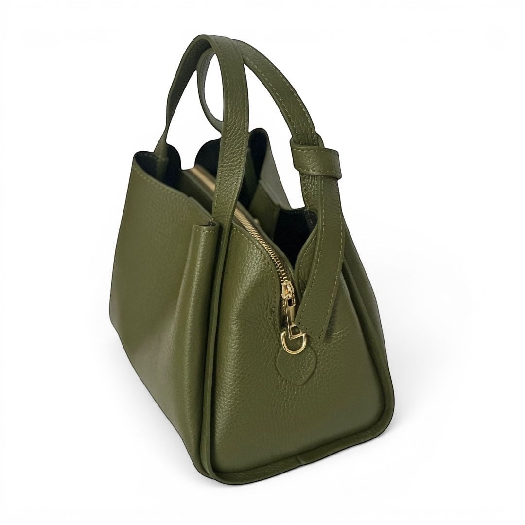 Green mini tote bag showing large zipped centre pocket and organised interior compartments