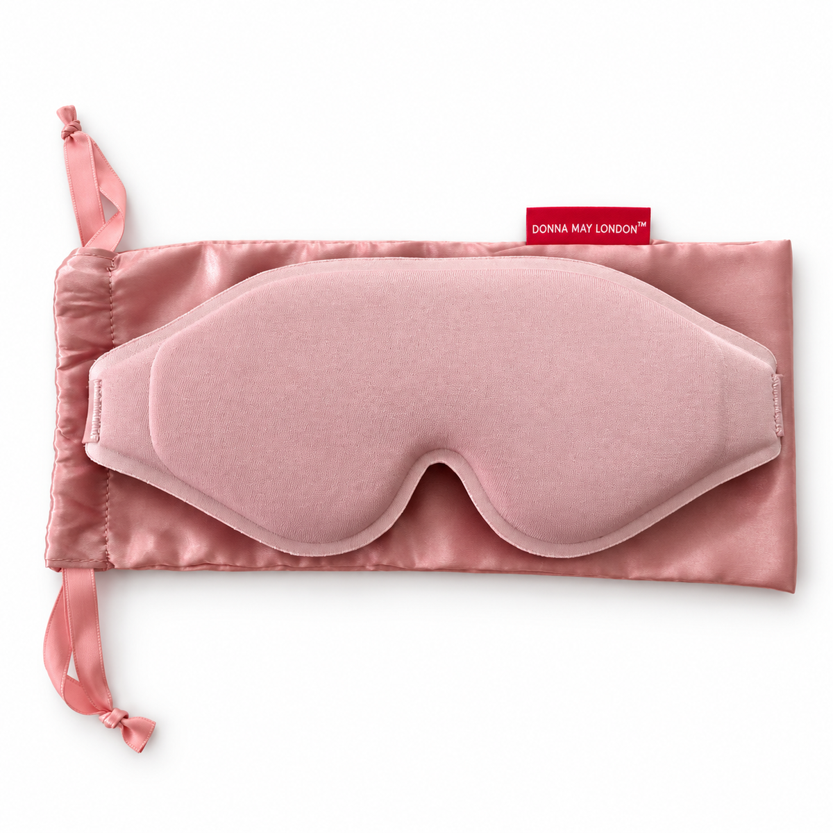Donna May London blush pink EasySleep mask resting on its matching satin drawstring storage pouch